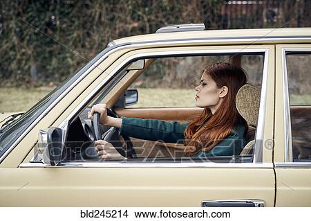 Picture - Caucasian woman driving car. Fotosearch