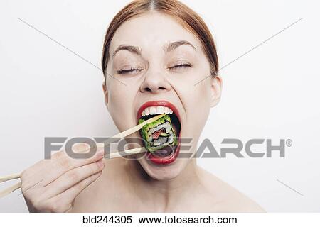 Caucasian woman eating sushi with chopsticks View Large Photo Image Stock Photography - Caucasian woman eating sushi with chopsticks. Fotosearch