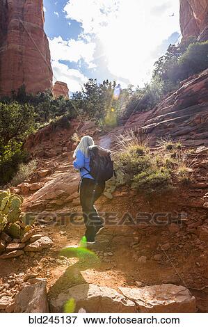 Caucasian woman hiking in desert landscape View Large Photo Image Stock Photo - Caucasian woman hiking in desert landscape. Fotosearch