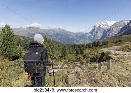 Stock Photo - Caucasian woman hiking in mountains. Fotosearch