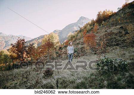 Caucasian woman hiking on mountain in autumn View Large Photo Image Stock Image - Caucasian woman hiking on mountain in autumn. Fotosearch