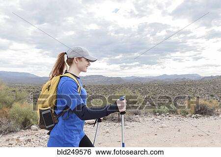 Caucasian woman hiking on rocky path in desert View Large Photo Image Stock Photograph - Caucasian woman hiking on rocky path in desert. Fotosearch