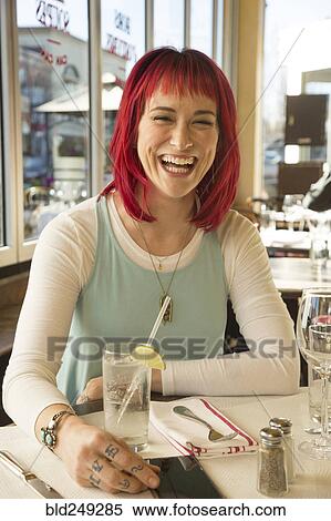 Caucasian woman laughing in restaurant View Large Photo Image Stock Photography - Caucasian woman laughing in restaurant. Fotosearch