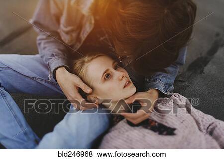 Caucasian woman laying in lap of man View Large Photo Image Stock Photo - Caucasian woman laying in lap of man. Fotosearch