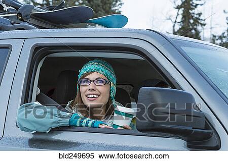 Caucasian woman leaning in car window in winter View Large Photo Image Stock Photography - Caucasian woman leaning in car window in winter. Fotosearch