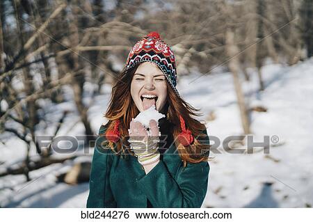 Caucasian woman licking snow View Large Photo Image Stock Photograph - Caucasian woman licking snow. Fotosearch