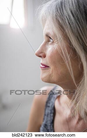 Stock Image - Caucasian woman looking away. Fotosearch