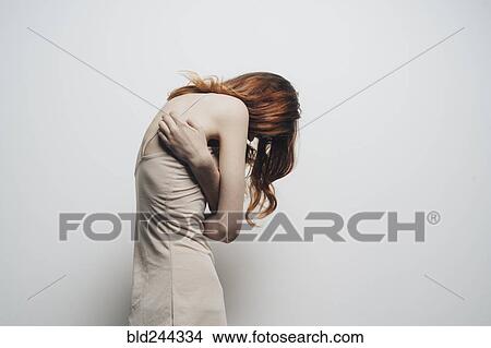 Picture - Caucasian woman looking down. Fotosearch
