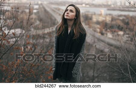 Caucasian woman looking up outdoors View Large Photo Image Stock Photo - Caucasian woman looking up outdoors. Fotosearch