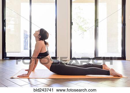 Caucasian woman performing yoga View Large Photo Image Stock Image - Caucasian woman performing yoga. Fotosearch