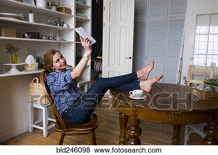 Caucasian woman posing for selfie with digital tablet View Large Photo Image Stock Photo - Caucasian woman posing for selfie with digital tablet. Fotosearch