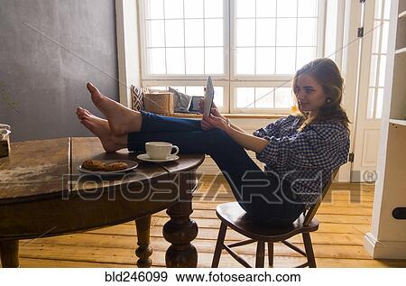 Caucasian woman posing for selfie with digital tablet View Large Photo Image Stock Photo - Caucasian woman posing for selfie with digital tablet. Fotosearch