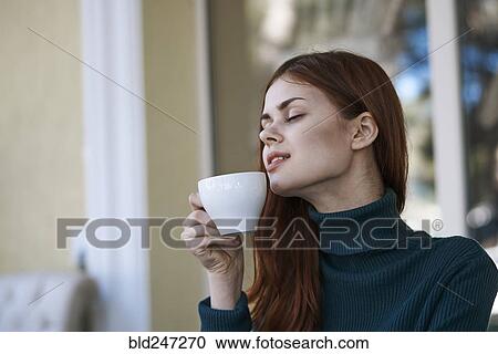 Caucasian woman relaxing and drinking coffee View Large Photo Image Stock Image - Caucasian woman relaxing and drinking coffee. Fotosearch