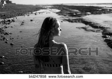 Caucasian woman relaxing on beach View Large Photo Image Stock Photo - Caucasian woman relaxing on beach. Fotosearch