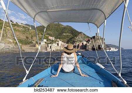 Caucasian woman relaxing on boat View Large Photo Image Stock Photo - Caucasian woman relaxing on boat. Fotosearch