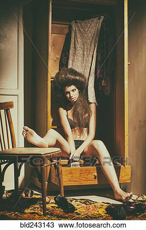 Caucasian woman sitting in wardrobe wearing underwear View Large Photo Image Stock Image - Caucasian woman sitting in wardrobe wearing underwear. Fotosearch