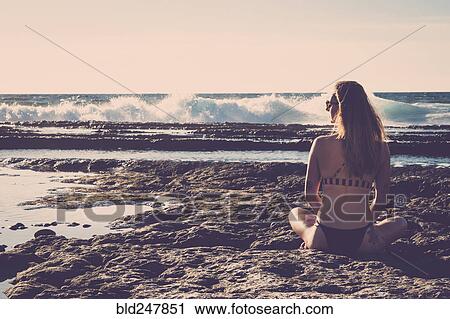Caucasian woman sitting on beach wearing bikini View Large Photo Image Stock Image - Caucasian woman sitting on beach wearing bikini. Fotosearch