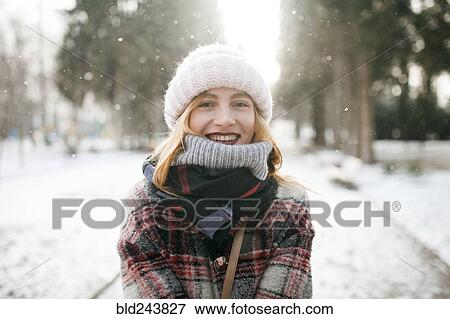 Caucasian woman smiling in snow View Large Photo Image Stock Photo - Caucasian woman smiling in snow. Fotosearch