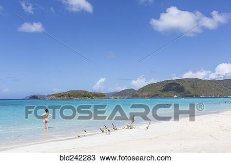 Caucasian woman standing in ocean on tropical beach View Large Photo Image Stock Image - Caucasian woman standing in ocean on tropical beach. Fotosearch
