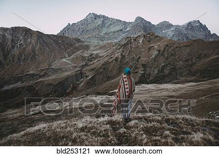 Caucasian woman standing in remote mountain landscape View Large Photo Image Stock Image - Caucasian woman standing in remote mountain landscape. Fotosearch