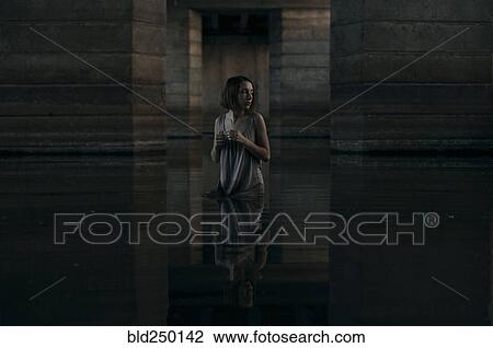 Caucasian woman standing waist deep in water View Large Photo Image Stock Image - Caucasian woman standing waist deep in water. Fotosearch