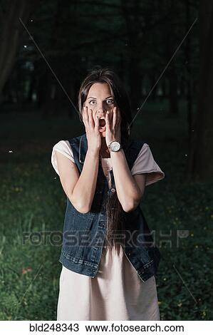Caucasian woman surprised at night View Large Photo Image Stock Image - Caucasian woman surprised at night. Fotosearch