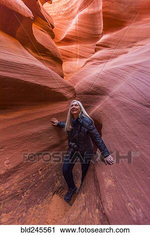 Caucasian woman walking in rock formation View Large Photo Image Stock Image - Caucasian woman walking in rock formation. Fotosearch