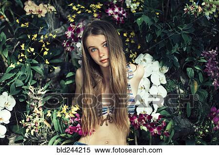 Caucasian woman wearing bikini sitting in flowers View Large Photo Image Stock Photography - Caucasian woman wearing bikini sitting in flowers. Fotosearch