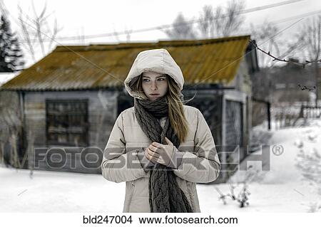Caucasian woman wearing coat and scarf in winter View Large Photo Image Picture - Caucasian woman wearing coat and scarf in winter. Fotosearch