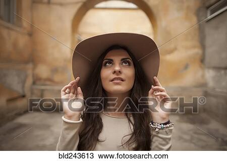 Caucasian woman wearing hat looking up View Large Photo Image Stock Image - Caucasian woman wearing hat looking up. Fotosearch