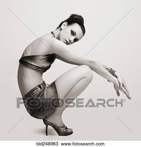 Caucasian woman wearing miniskirt and high heels View Large Photo Image Stock Image - Caucasian woman wearing miniskirt and high heels. Fotosearch
