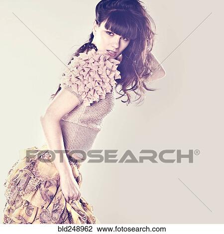 Stock Image - Caucasian woman wearing ruffled skirt. Fotosearch