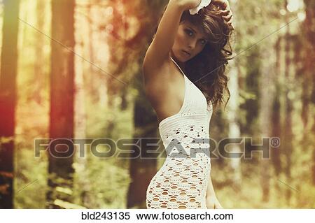 Caucasian woman wearing sheer dress in forest View Large Photo Image Stock Photography - Caucasian woman wearing sheer dress in forest. Fotosearch