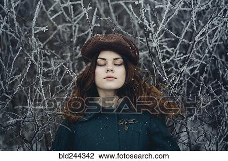 Caucasian woman with eyes closed near icy branches View Large Photo Image Stock Image - Caucasian woman with eyes closed near icy branches. Fotosearch