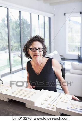 Caucasian woman working in jewelry store View Large Photo Image Stock Photograph - Caucasian woman working in jewelry store. Fotosearch