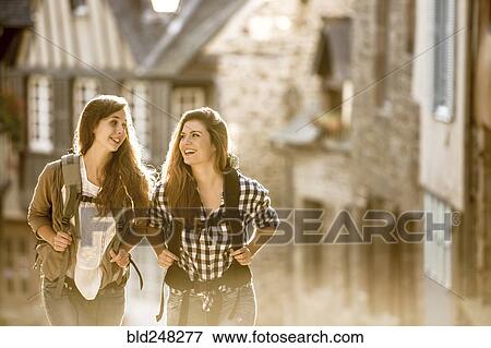 Caucasian women backpacking in city View Large Photo Image Stock Photo - Caucasian women backpacking in city. Fotosearch