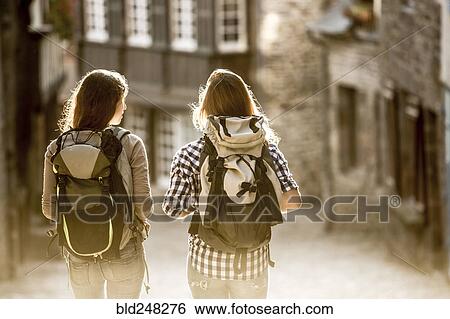 Caucasian women backpacking in city View Large Photo Image Stock Photograph - Caucasian women backpacking in city. Fotosearch