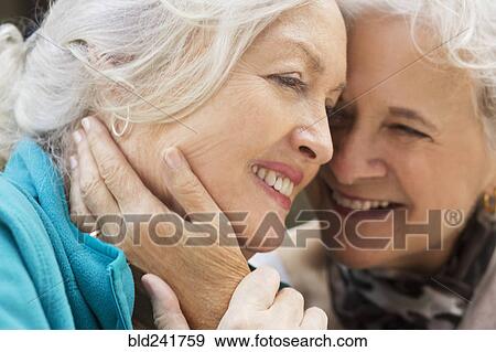 Caucasian women embracing View Large Photo Image Stock Photo - Caucasian women embracing. Fotosearch