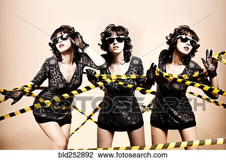 Caucasian women tangled in caution tape View Large Photo Image Stock Image - Caucasian women tangled in caution tape. Fotosearch