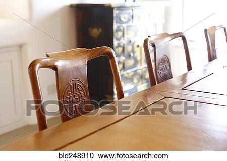 Chairs with carvings at the table View Large Photo Image Stock Image - Chairs with carvings at the table. Fotosearch