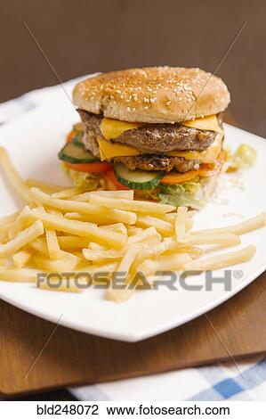 Stock Image - Cheeseburger and french fries. Fotosearch