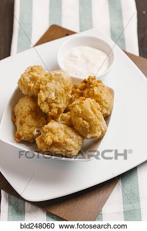 Chicken nuggets and dipping sauce View Large Photo Image Stock Image - Chicken nuggets and dipping sauce. Fotosearch