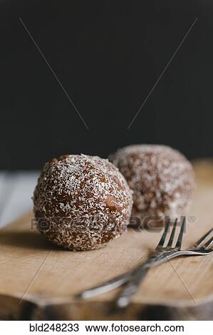 Chocolate balls with forks on cutting board View Large Photo Image Stock Image - Chocolate balls with forks on cutting board. Fotosearch