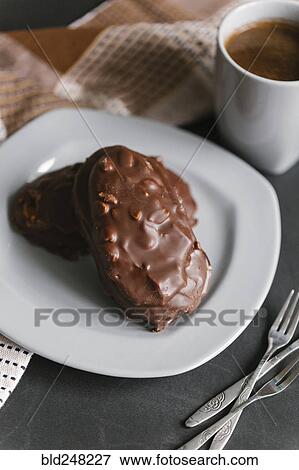 Stock Photo - Chocolate cookies with nuts on plate. Fotosearch