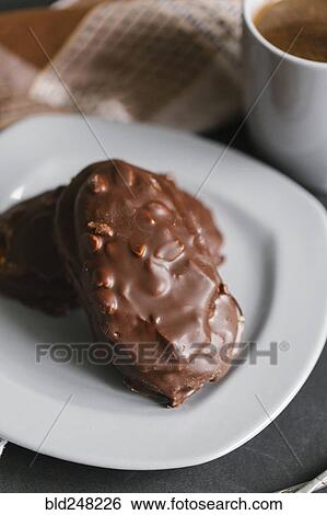 Chocolate cookies with nuts on plate View Large Photo Image Stock Photograph - Chocolate cookies with nuts on plate. Fotosearch