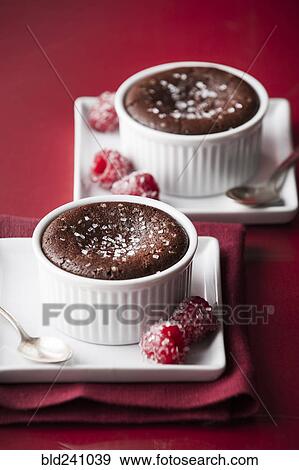 Chocolate souffle and raspberries View Large Photo Image Stock Photo - Chocolate souffle and raspberries. Fotosearch