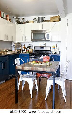 Stock Image - Chopped vegetables on table in kitchen. Fotosearch