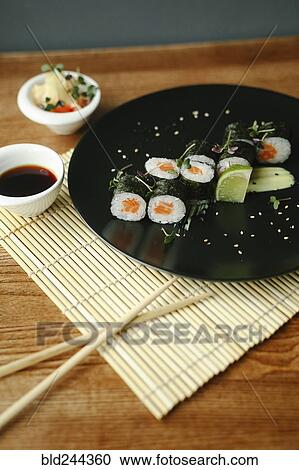 Chopsticks and sushi with sauce View Large Photo Image Stock Image - Chopsticks and sushi with sauce. Fotosearch
