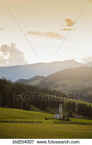 Stock Photo - Church in remote mountain landscape, Funes, Trentino Alto Adige, Italy. Fotosearch