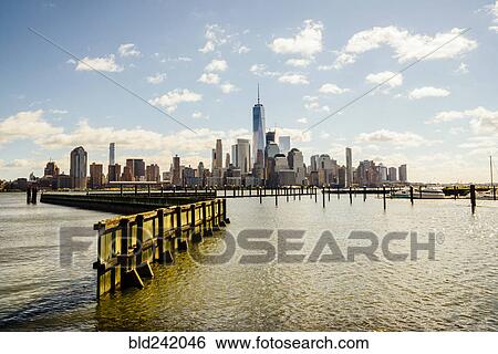 City skyline at waterfront, New York, New York, United States View Large Photo Image Stock Photograph - City skyline at waterfront, New York, New York, United States. Fotosearch